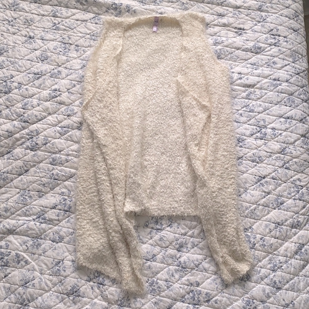 Long white fluffy sleeveless sweater